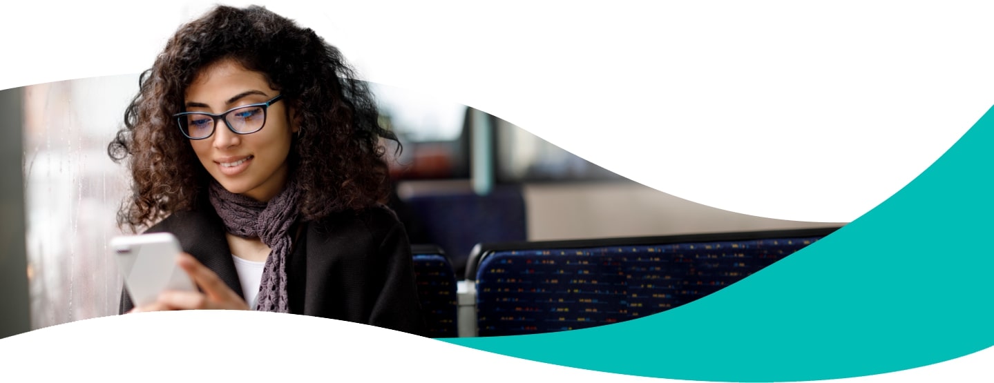 Woman with glasses holding phone